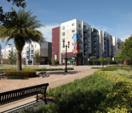 The Trio at ENCORE! building exterior with plaza, palm trees and Tampa skyline