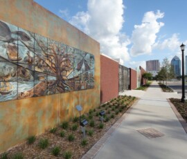 Public art mural wall with Tampa skyline in the background at ENCORE!