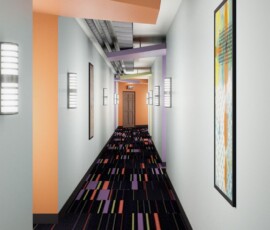 Residential hallway with colorful carpet and artwork at The Tempo at ENCORE!